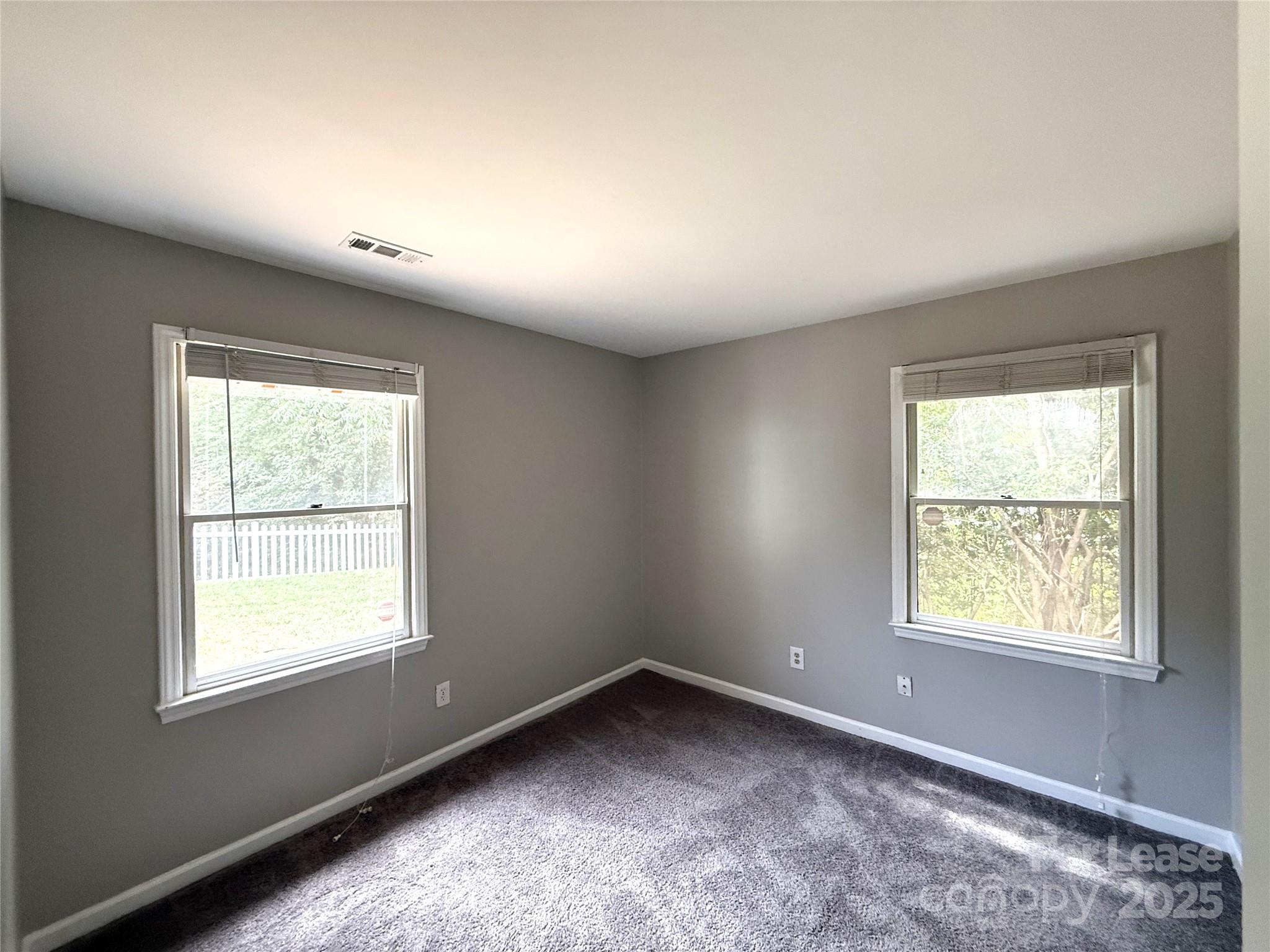 420 Beaty Street Davidson, NC 28036 - Photo 8 of 15 an empty room with a window