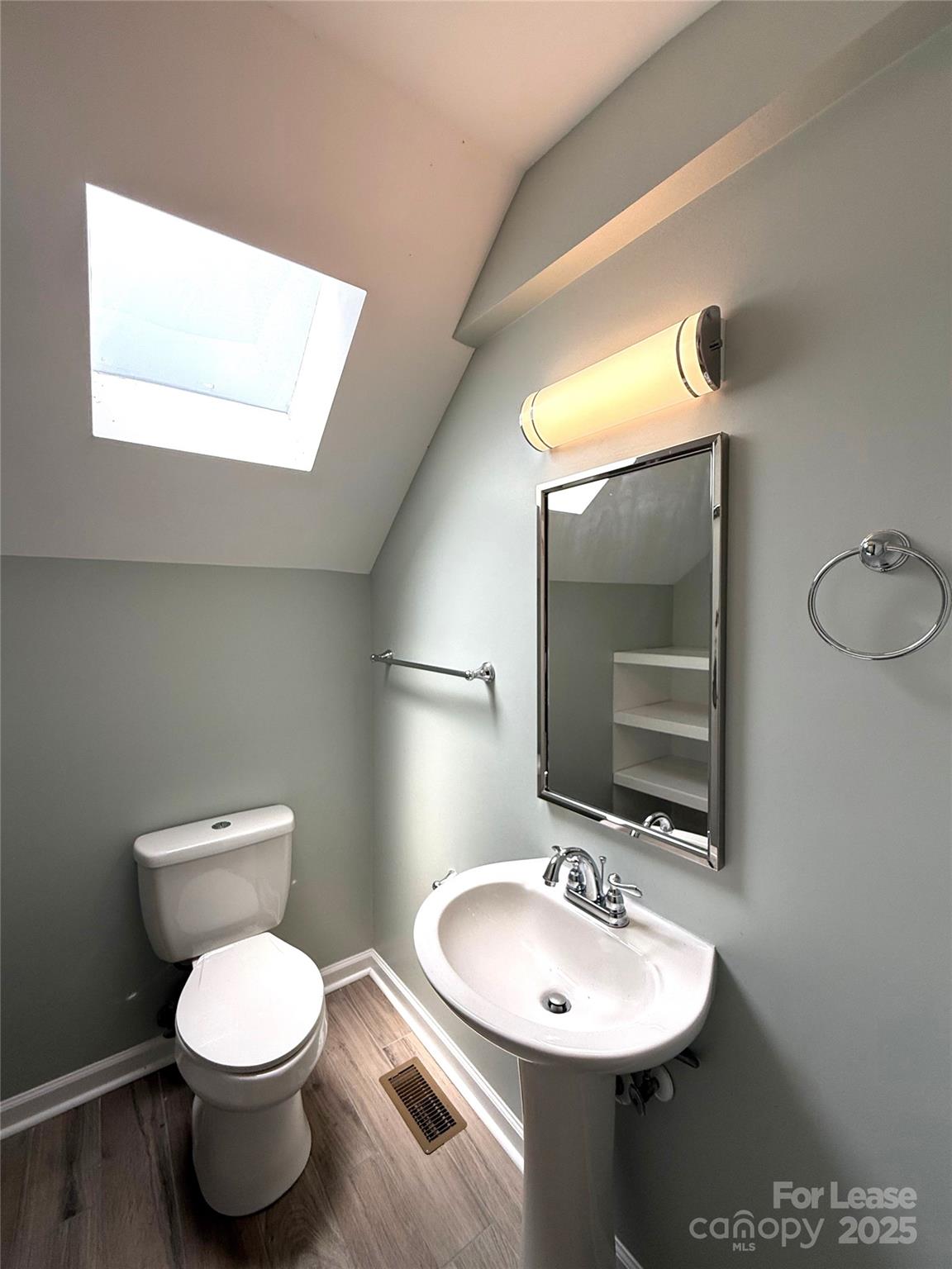 420 Beaty Street Davidson, NC 28036 - Photo 10 of 15 a bathroom with a toilet sink and mirror