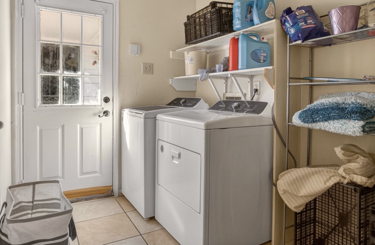14731 Ridgechase Lane Houston, TX 77014 - Photo 16 of 37 a utility room with dryer and washer