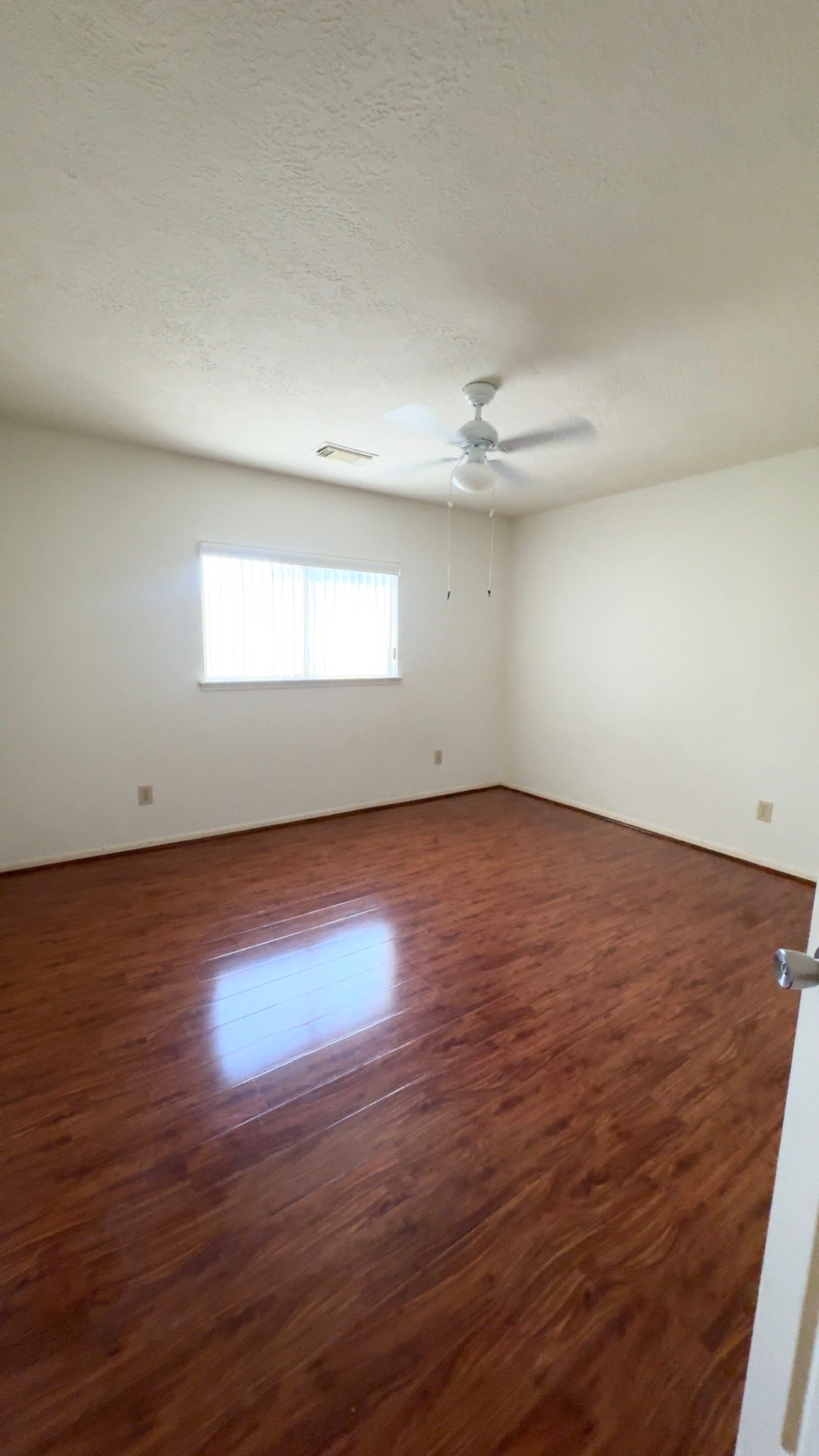 14731 Ridgechase Lane Houston, TX 77014 - Photo 19 of 37 an empty room with wooden floor and windows