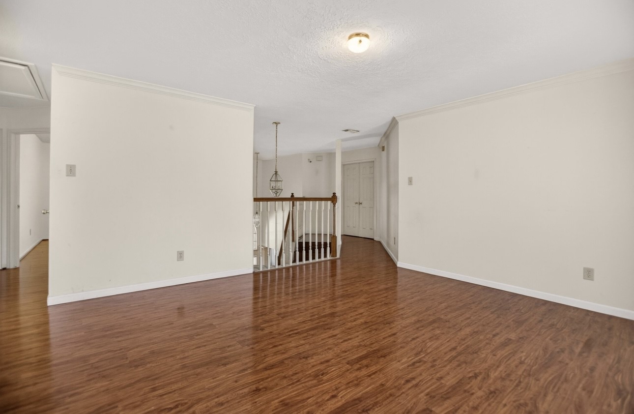 14731 Ridgechase Lane Houston, TX 77014 - Photo 25 of 37 a view of empty room with wooden floor
