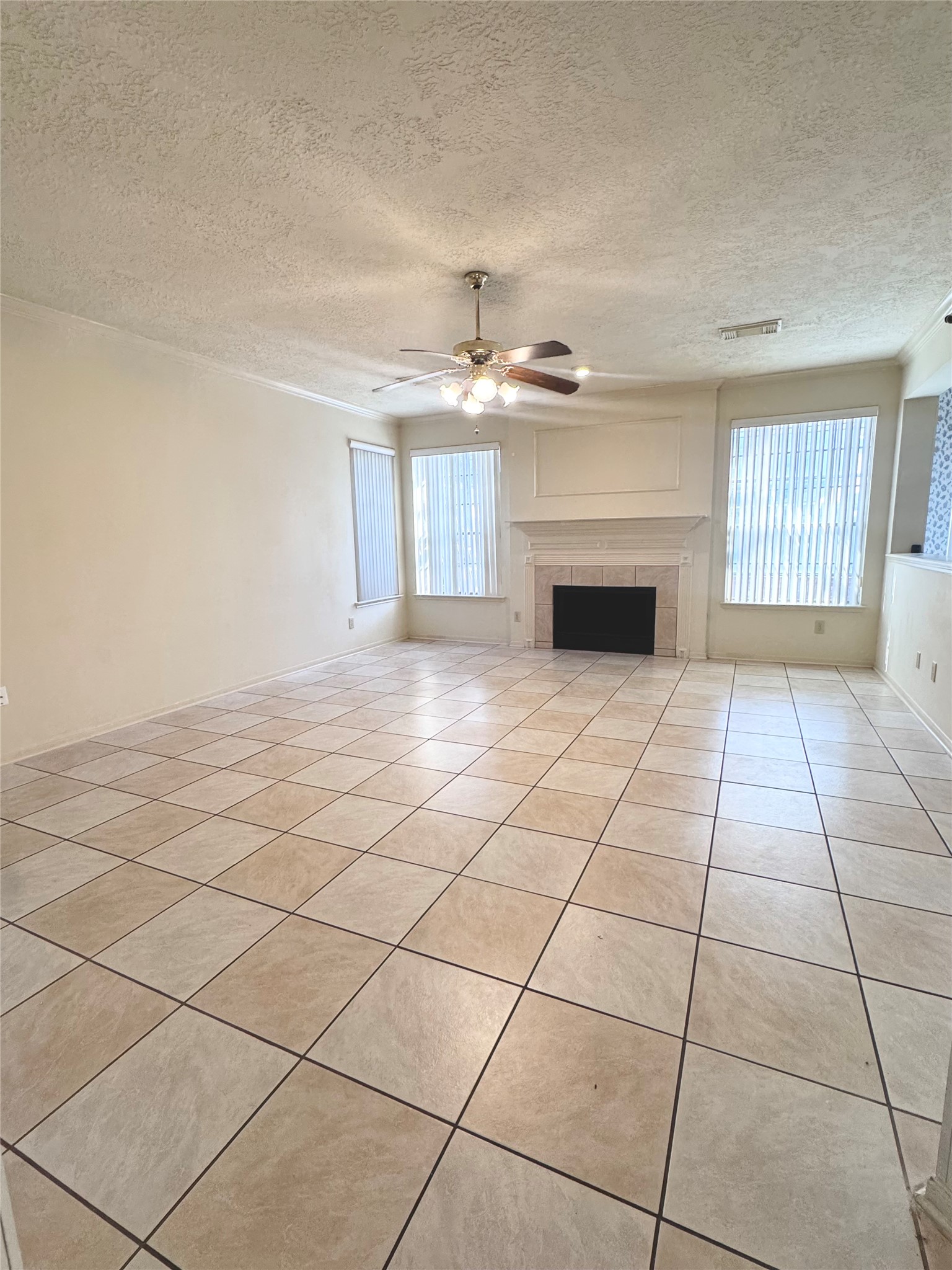 14731 Ridgechase Lane Houston, TX 77014 - Photo 9 of 37 a view of an empty room with a fireplace and a window