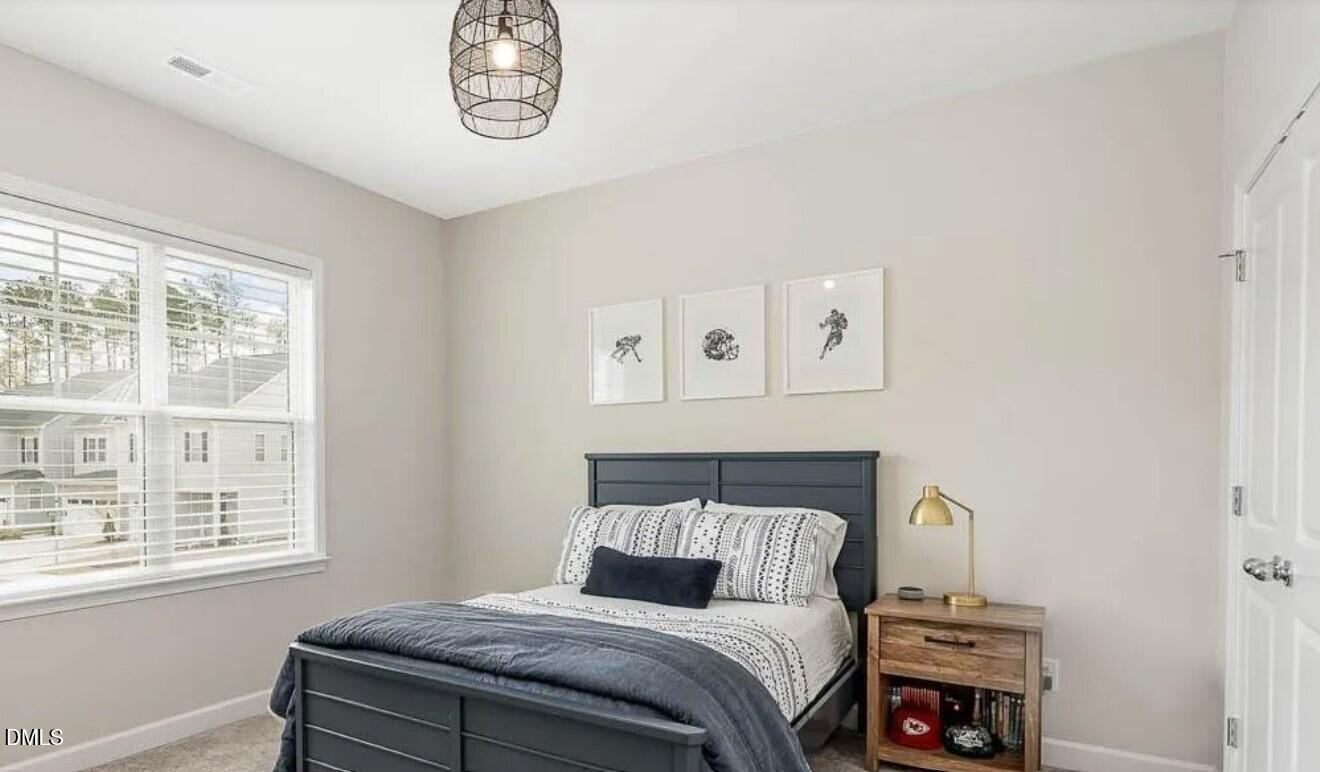 212 Bridge Point Drive Rolesville, NC 27571 - Photo 13 of 13 a bedroom with a bed and a window