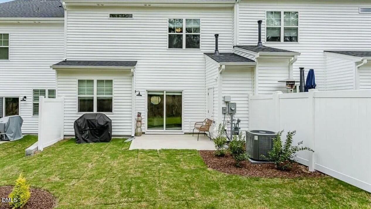 212 Bridge Point Drive Rolesville, NC 27571 - Photo 2 of 13 a view of a house with a backyard