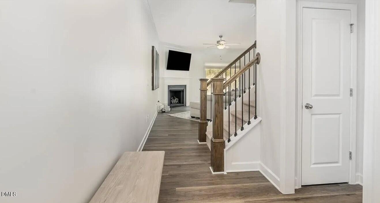 212 Bridge Point Drive Rolesville, NC 27571 - Photo 3 of 13 a view of a hallway with wooden floor and staircase