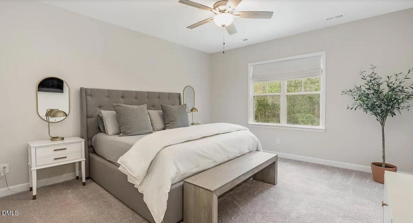 212 Bridge Point Drive Rolesville, NC 27571 - Photo 9 of 13 a bedroom with a bed and a window