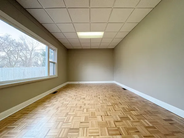 a view of empty room with windows