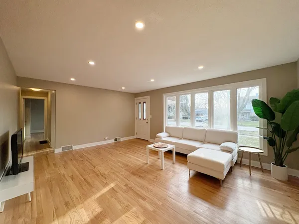 a living room with furniture and a large window