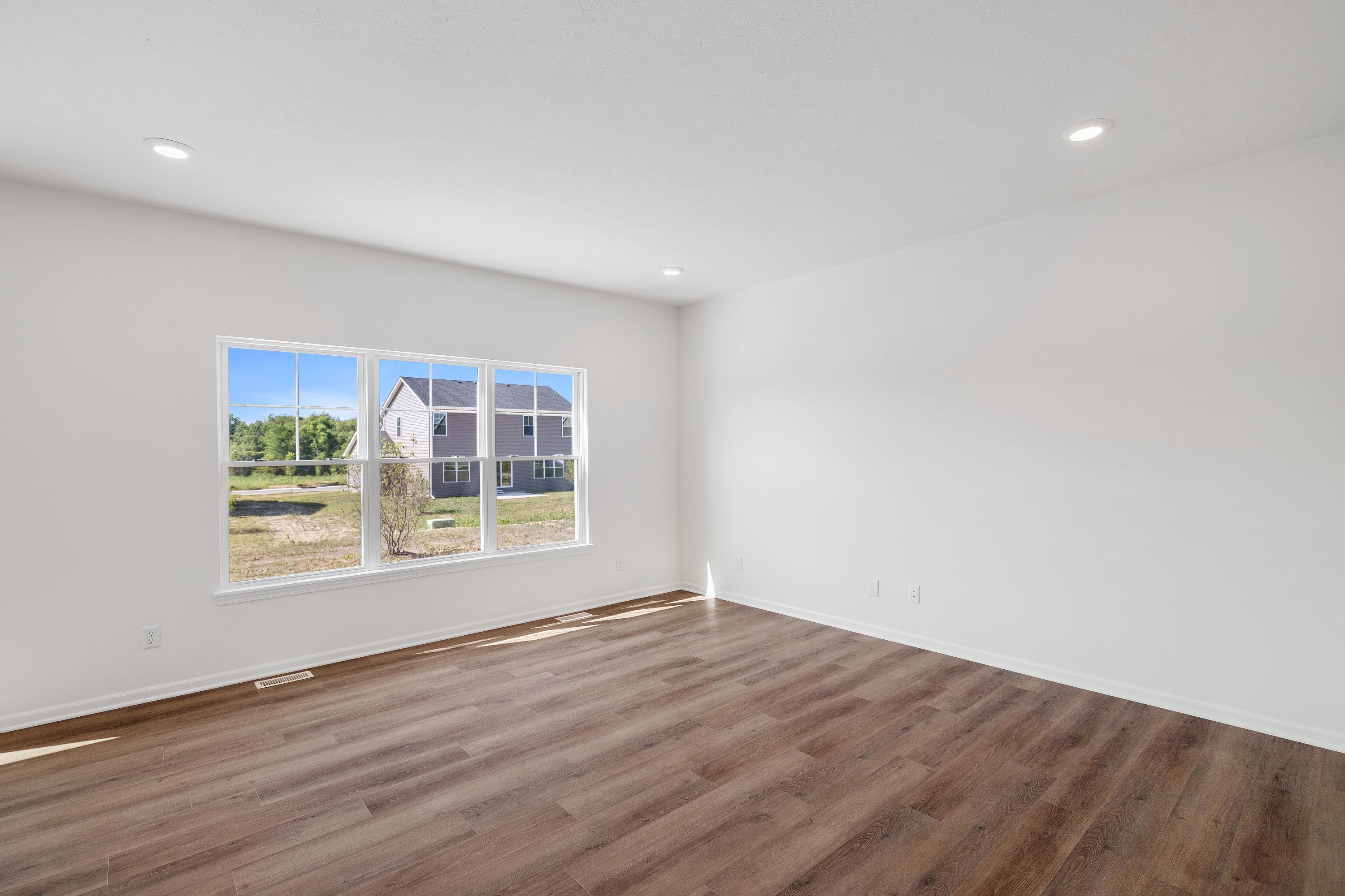 3755 Lookout Road Valparaiso, IN 46385 - Photo 3 of 21 a view of an empty room with wooden floor and a window