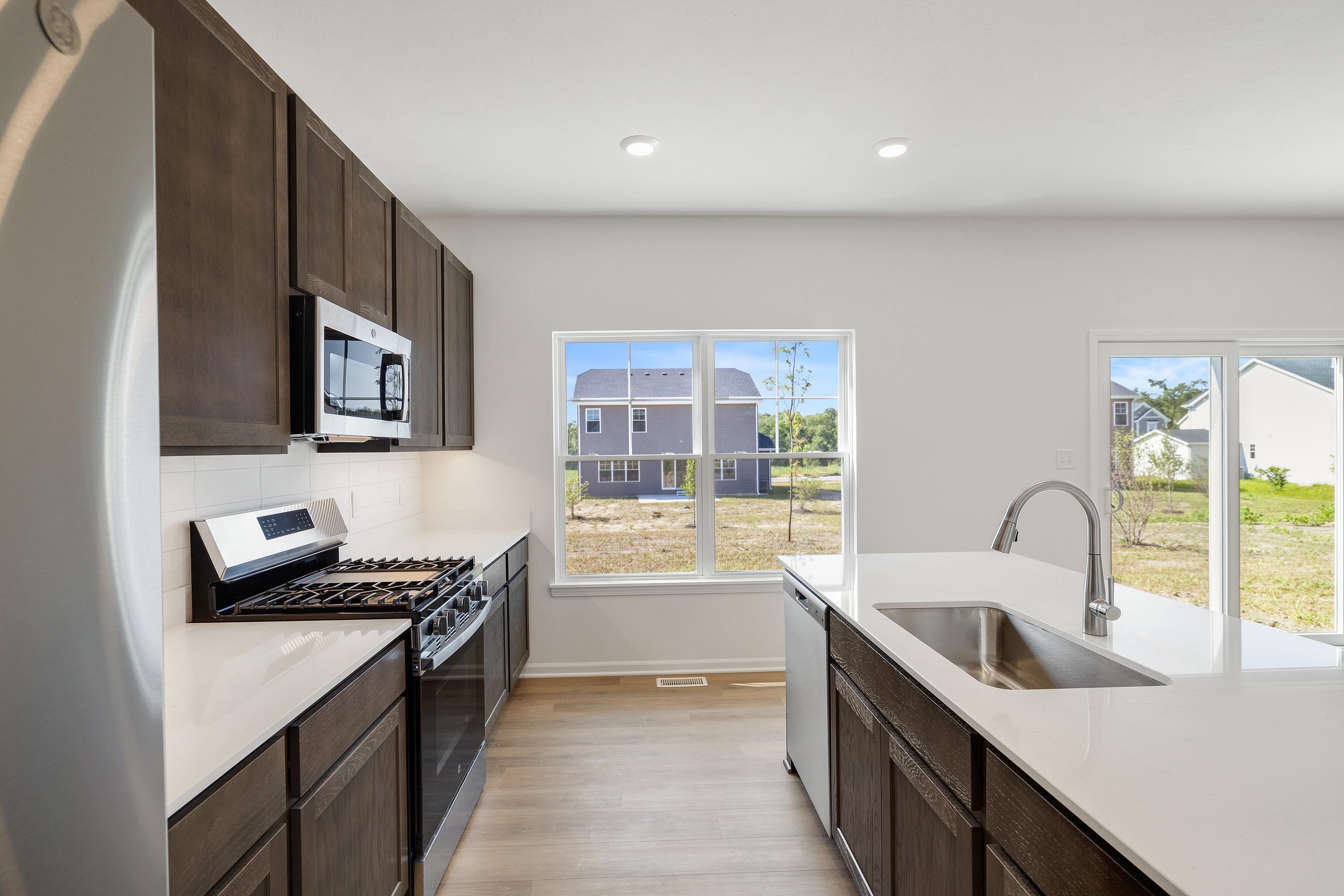 3755 Lookout Road Valparaiso, IN 46385 - Photo 9 of 21 a kitchen that has a sink and a stove