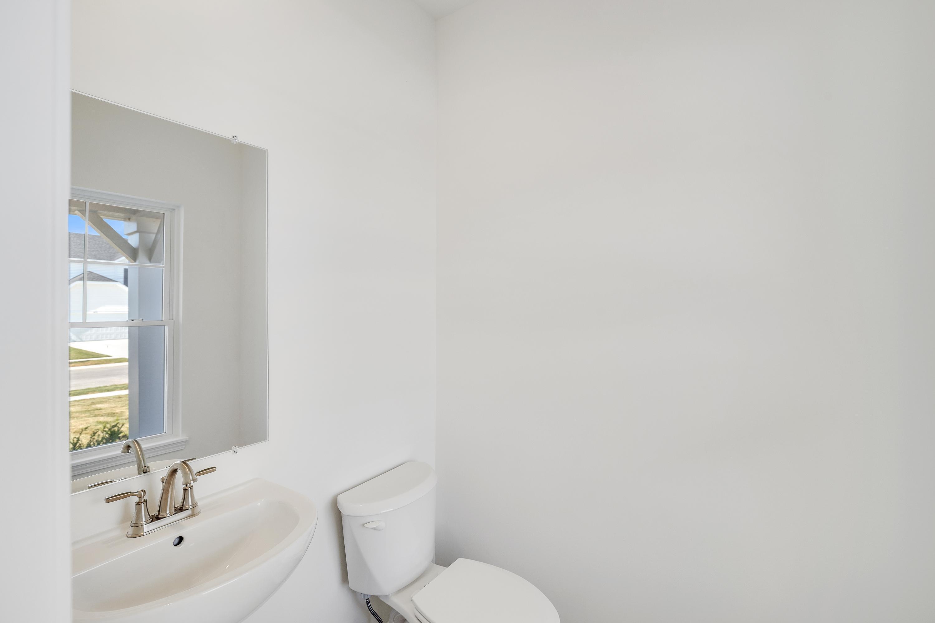 3755 Lookout Road Valparaiso, IN 46385 - Photo 10 of 21 a bathroom with a sink mirror and toilet
