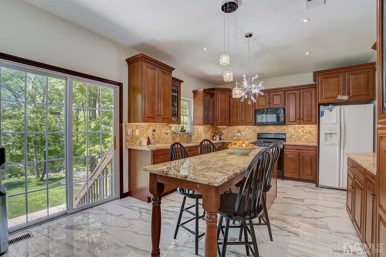 13 Revere Road Monmouth Junction, NJ 08852 - Photo 12 of 39 a view of a dining room with furniture large window and wooden floor