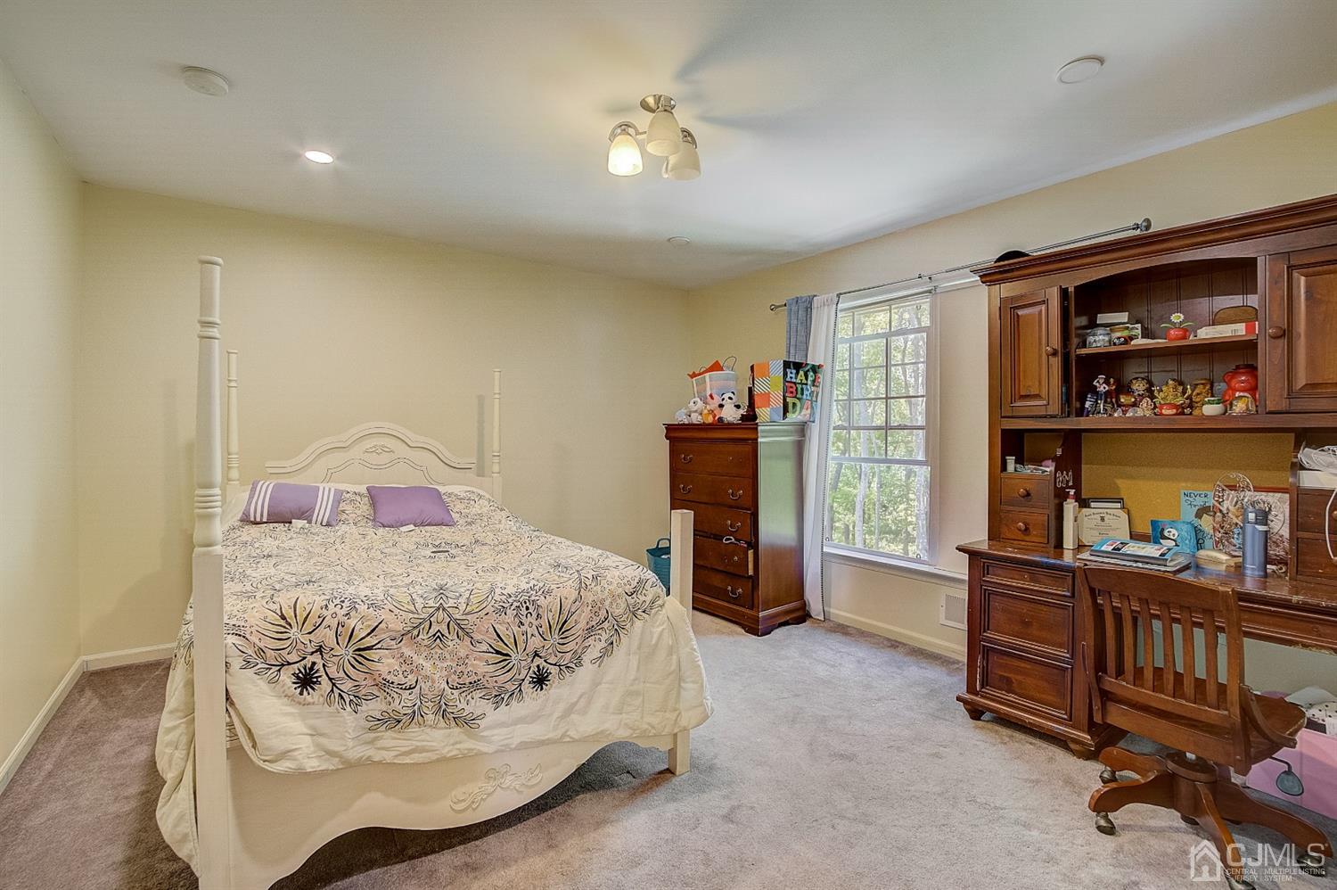 13 Revere Road Monmouth Junction, NJ 08852 - Photo 14 of 39 a bedroom with furniture and a bed