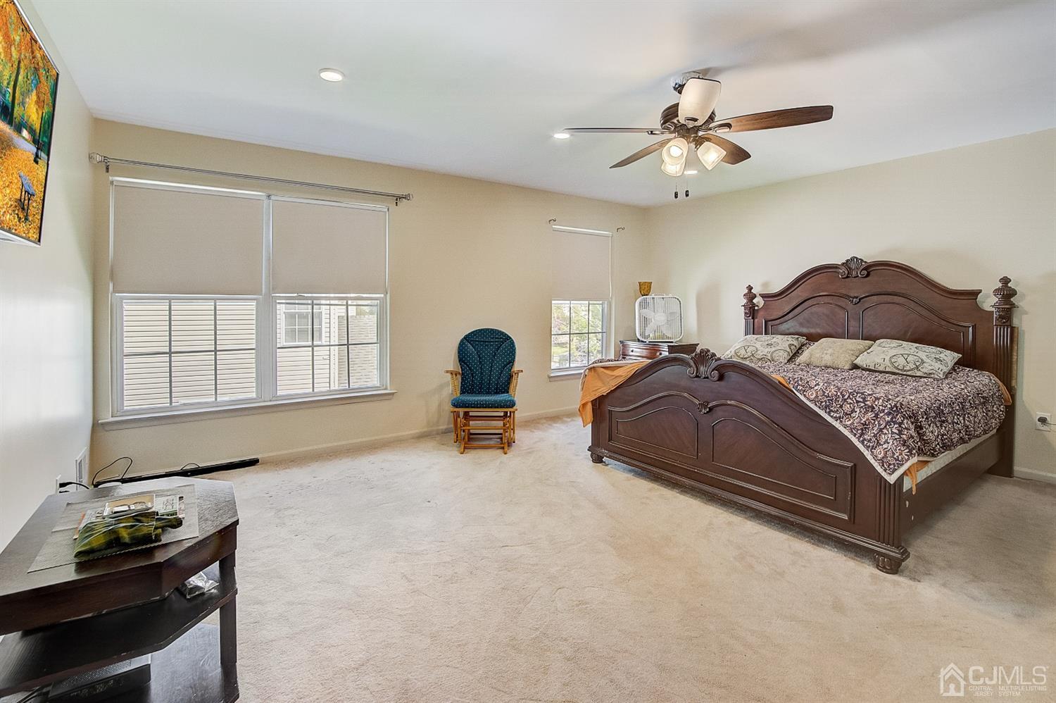 13 Revere Road Monmouth Junction, NJ 08852 - Photo 17 of 39 a spacious bedroom with a bed and a chandelier