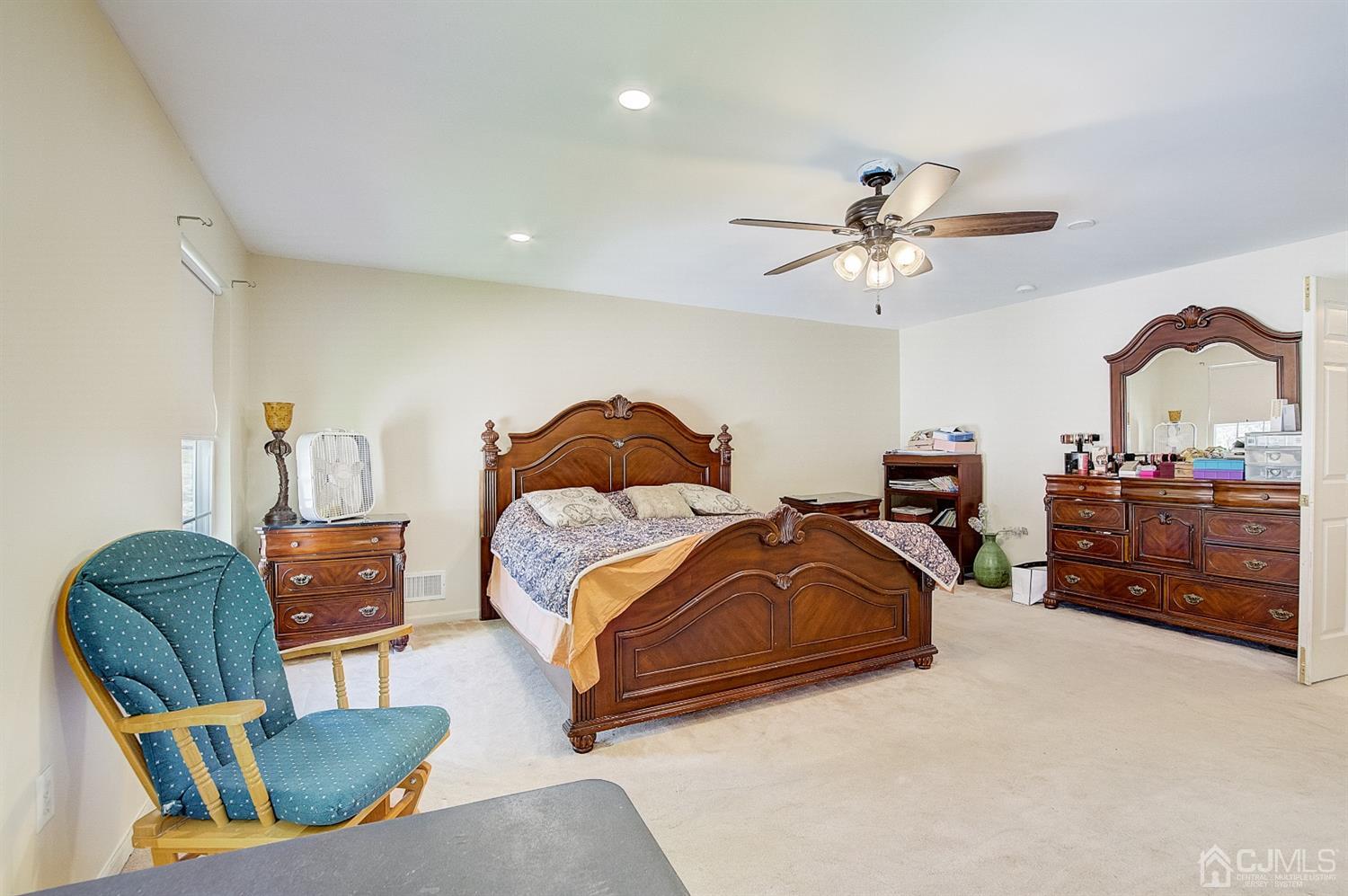13 Revere Road Monmouth Junction, NJ 08852 - Photo 18 of 39 a bedroom with furniture and a ceiling fan