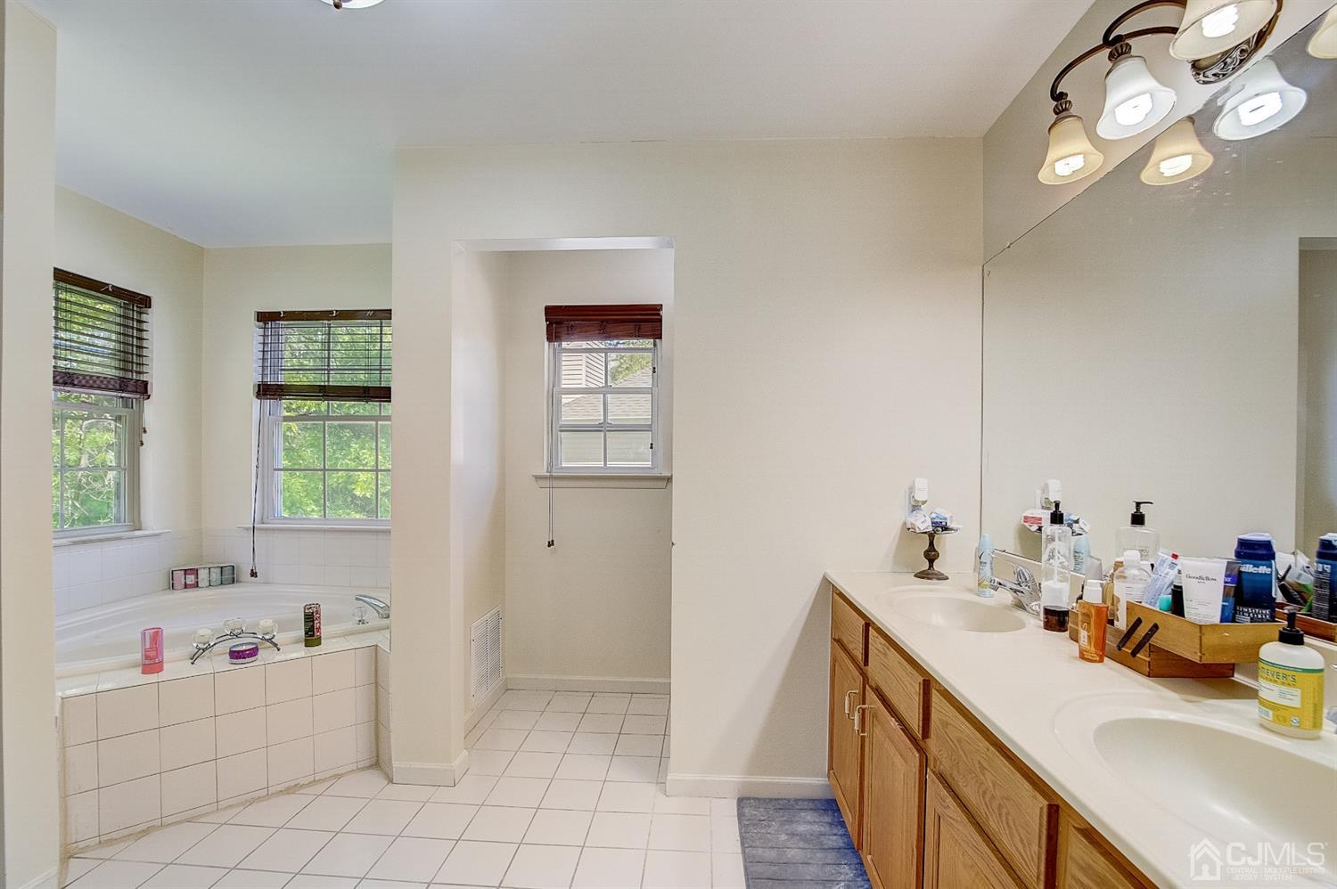 13 Revere Road Monmouth Junction, NJ 08852 - Photo 19 of 39 a bathroom with a sink vanity tub and shower