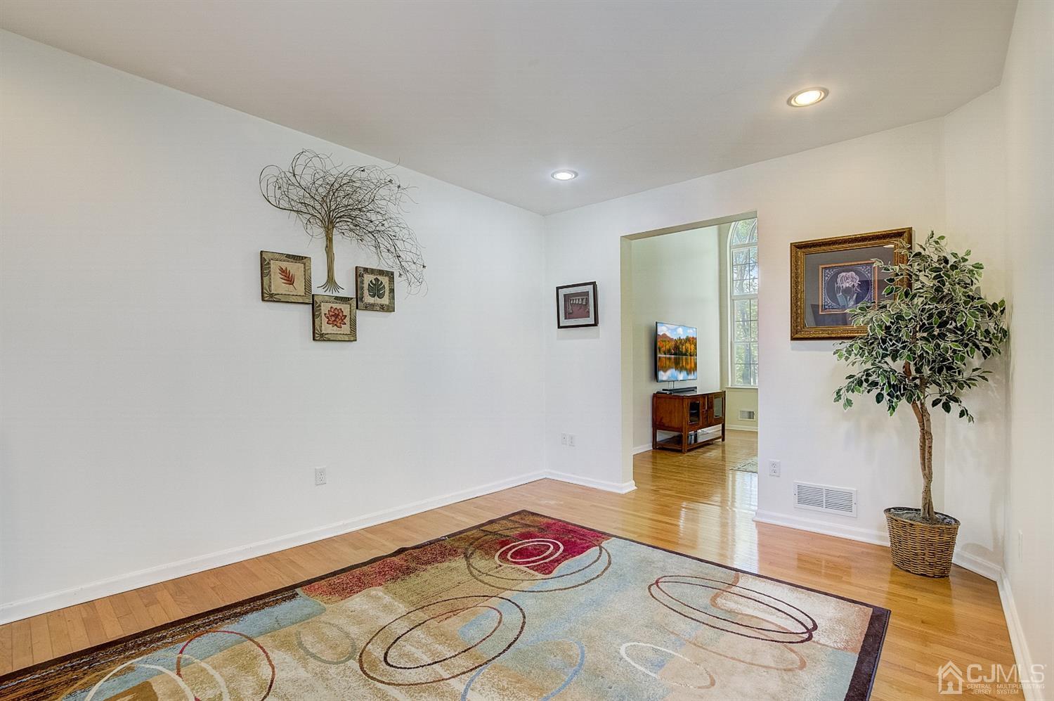 13 Revere Road Monmouth Junction, NJ 08852 - Photo 3 of 39 a living room with furniture and a potted plant