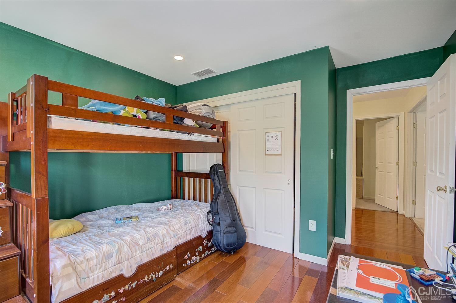 13 Revere Road Monmouth Junction, NJ 08852 - Photo 23 of 39 a bedroom with a bed and wooden floor