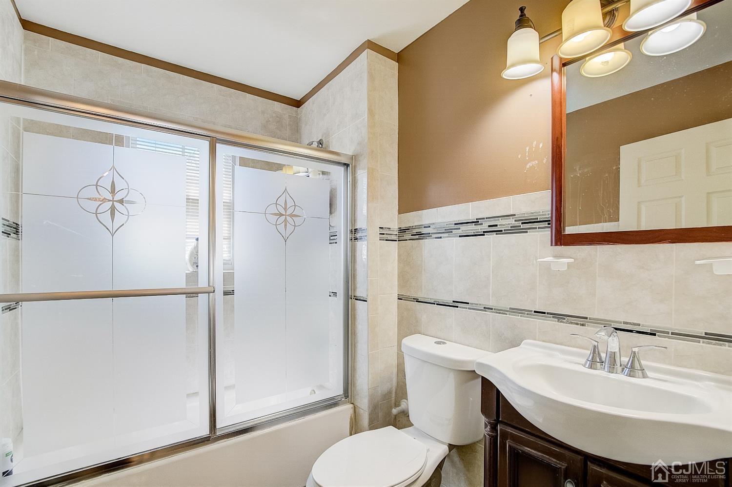 13 Revere Road Monmouth Junction, NJ 08852 - Photo 25 of 39 a bathroom with a sink toilet and a mirror