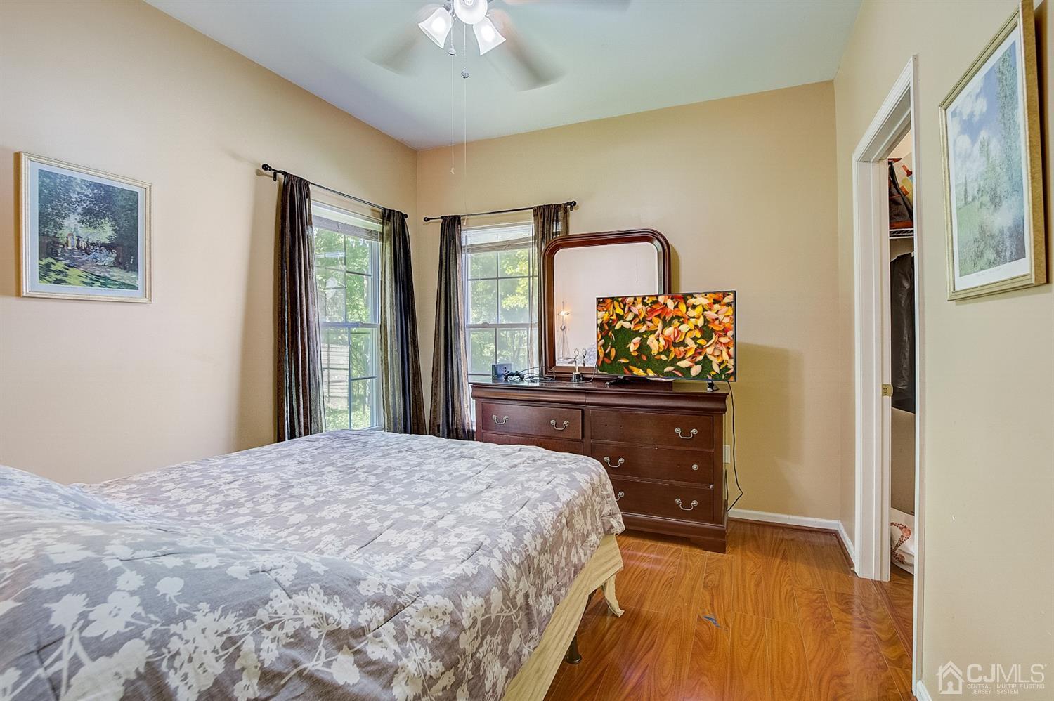 13 Revere Road Monmouth Junction, NJ 08852 - Photo 28 of 39 a bedroom with a bed and a flat tv screen on dresser