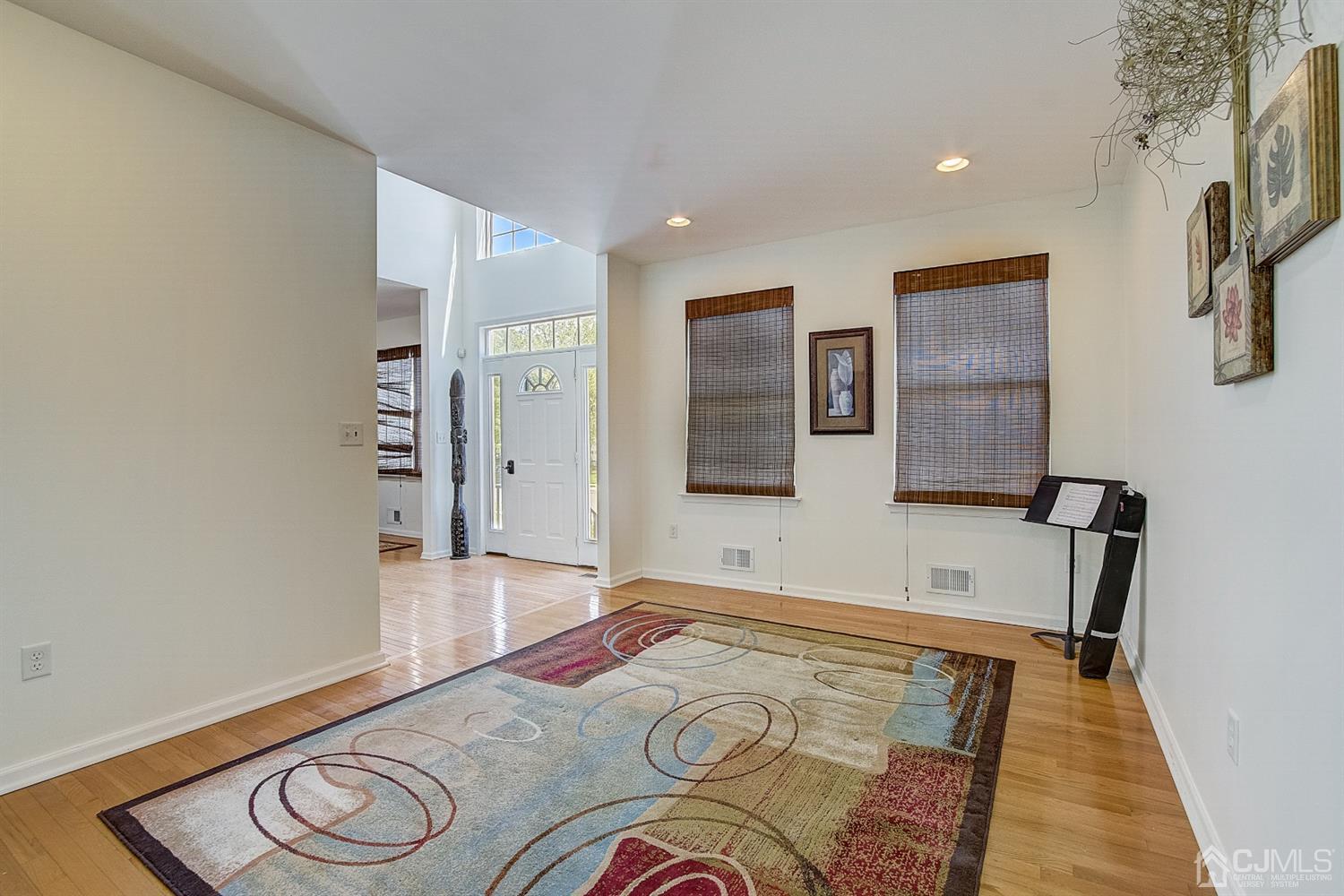 13 Revere Road Monmouth Junction, NJ 08852 - Photo 4 of 39 a view of livingroom with furniture and wooden floor