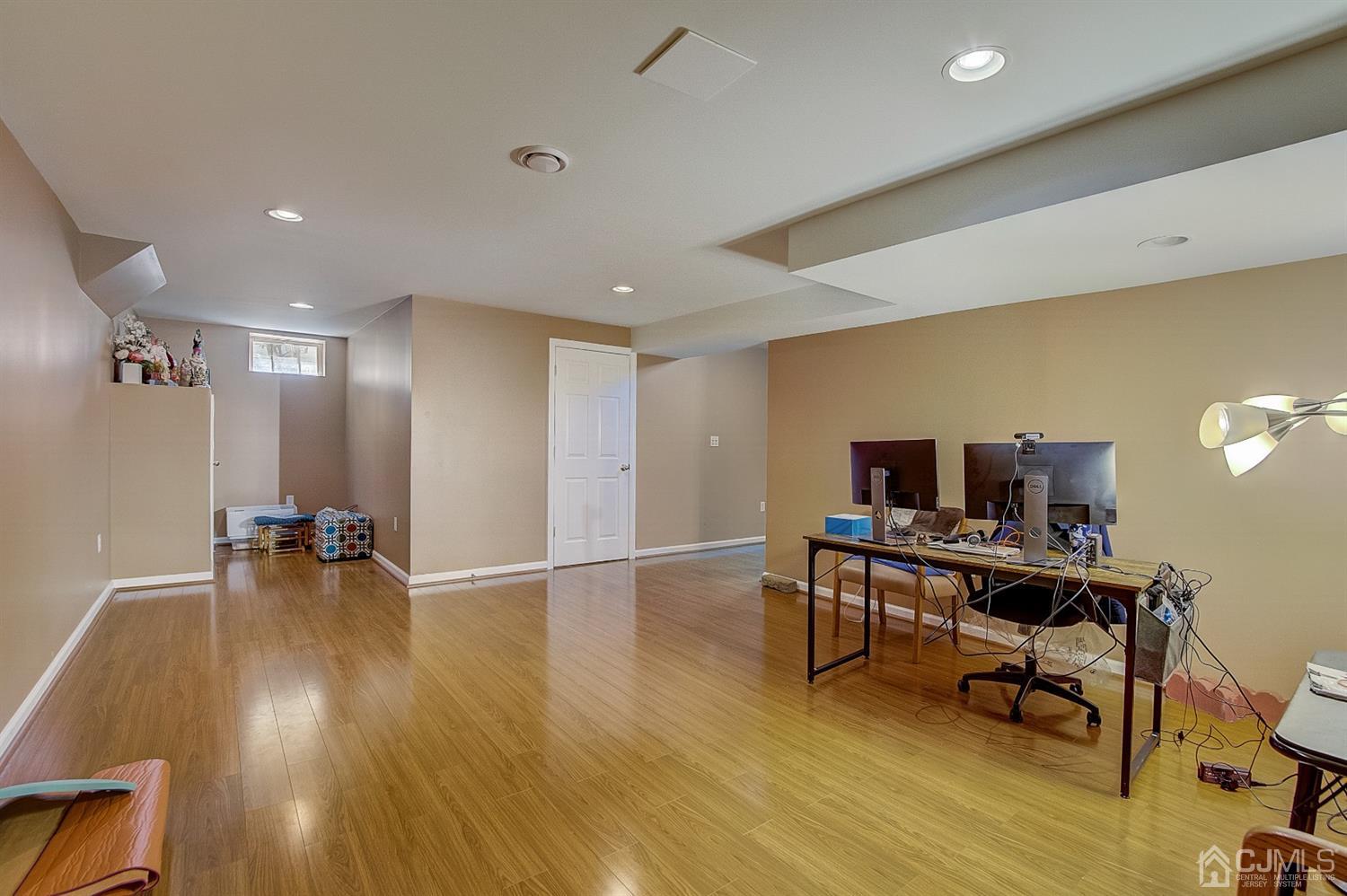 13 Revere Road Monmouth Junction, NJ 08852 - Photo 34 of 39 a view of a workspace with furniture and wooden floor