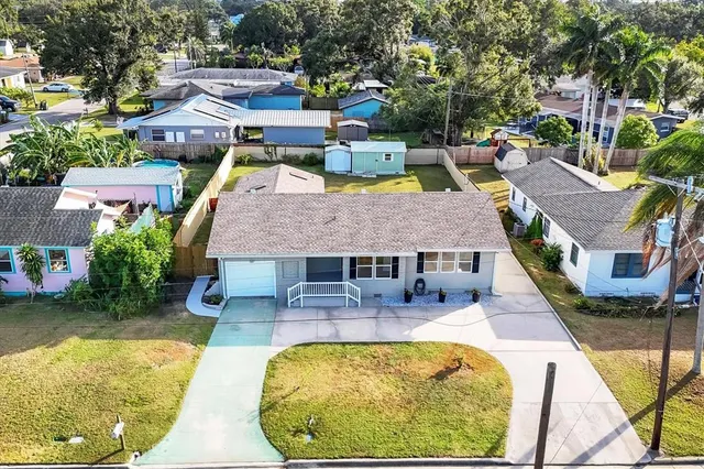 an aerial view of a house with swimming pool