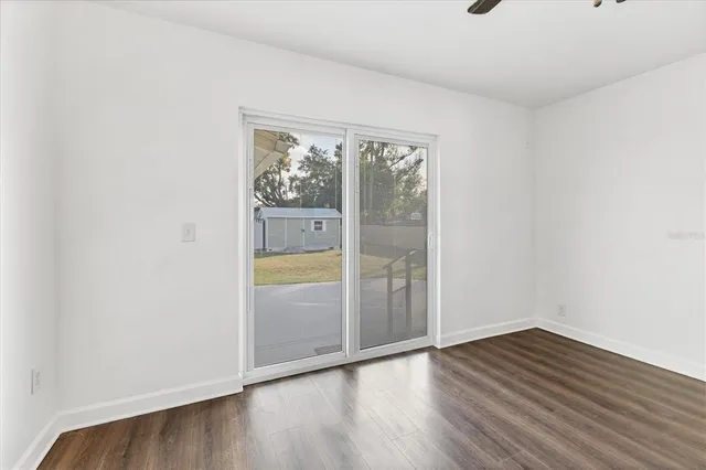 a view of a kitchen with a white cabinet and a stove top oven