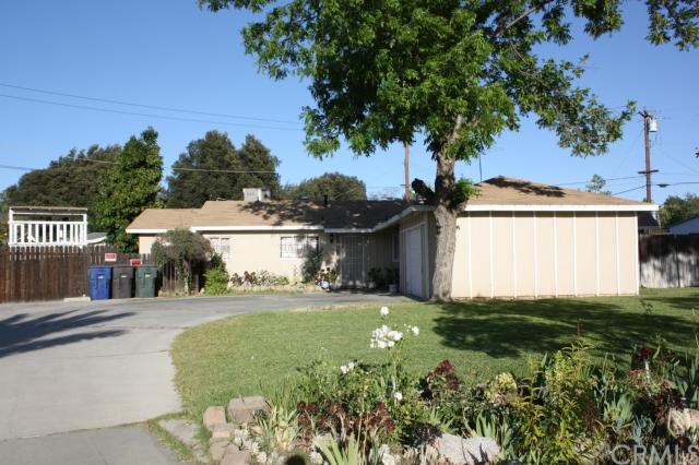3889 Hidden Lane Riverside, CA 92504 - Photo 1 of 1 a view of a house with a big yard and large tree