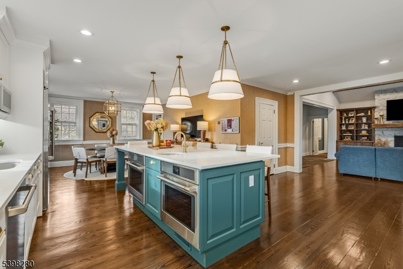 22 Talmage Road Mendham, NJ 07945 - Photo 11 of 46 a kitchen with stainless steel appliances granite countertop a stove and a wooden floors