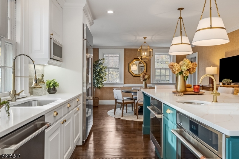 22 Talmage Road Mendham, NJ 07945 - Photo 18 of 46 a kitchen with stove a sink and a refrigerator with wooden floor