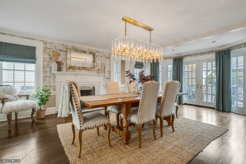 22 Talmage Road Mendham, NJ 07945 - Photo 24 of 46 a dining room with furniture a chandelier and wooden floor