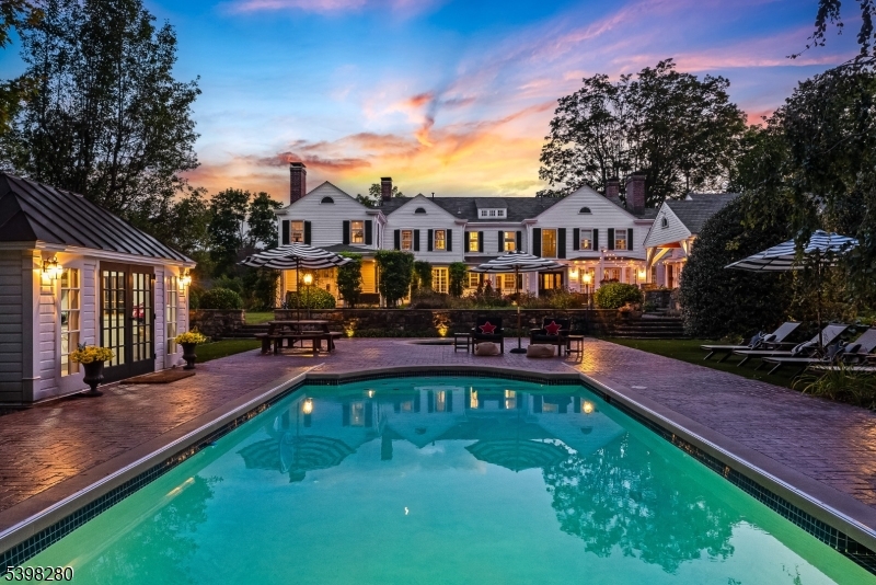 22 Talmage Road Mendham, NJ 07945 - Photo 3 of 46 a view of a house with swimming pool and sitting area