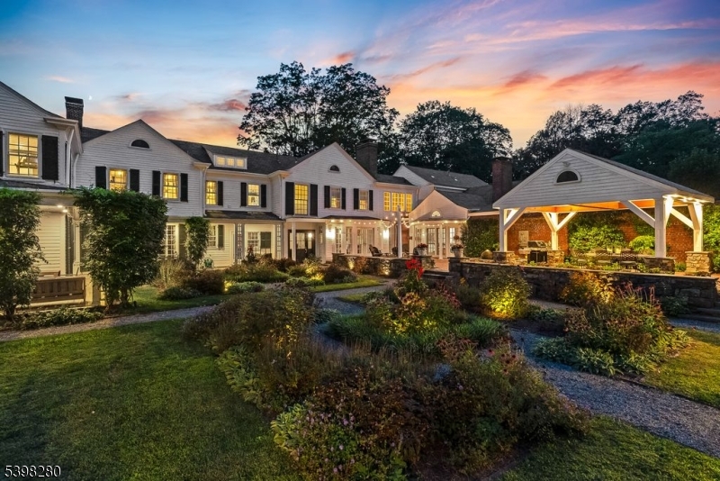 22 Talmage Road Mendham, NJ 07945 - Photo 4 of 46 a front view of a house with a garden