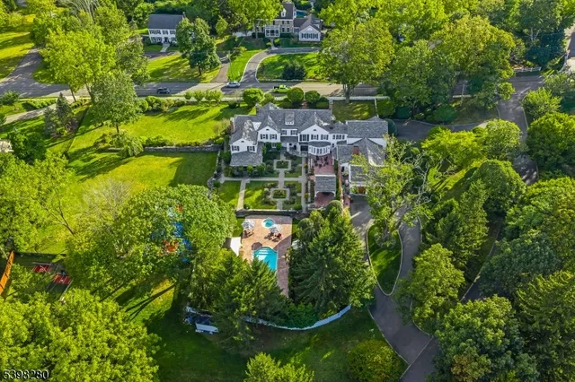 a view of a house with swimming pool and sitting area