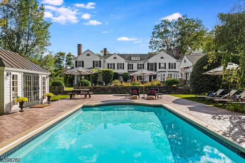22 Talmage Road Mendham, NJ 07945 - Photo 44 of 46 a view of a house with swimming pool and sitting area