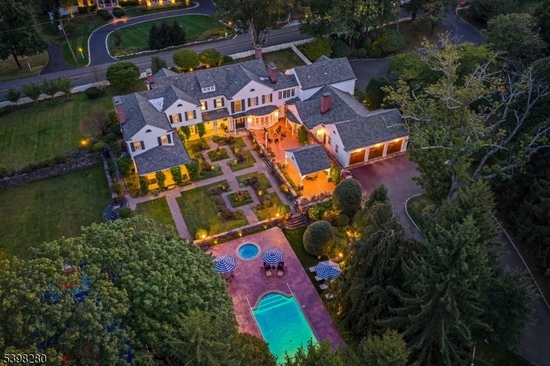 22 Talmage Road Mendham, NJ 07945 - Photo 5 of 46 an aerial view of house with swimming pool outdoor seating and yard