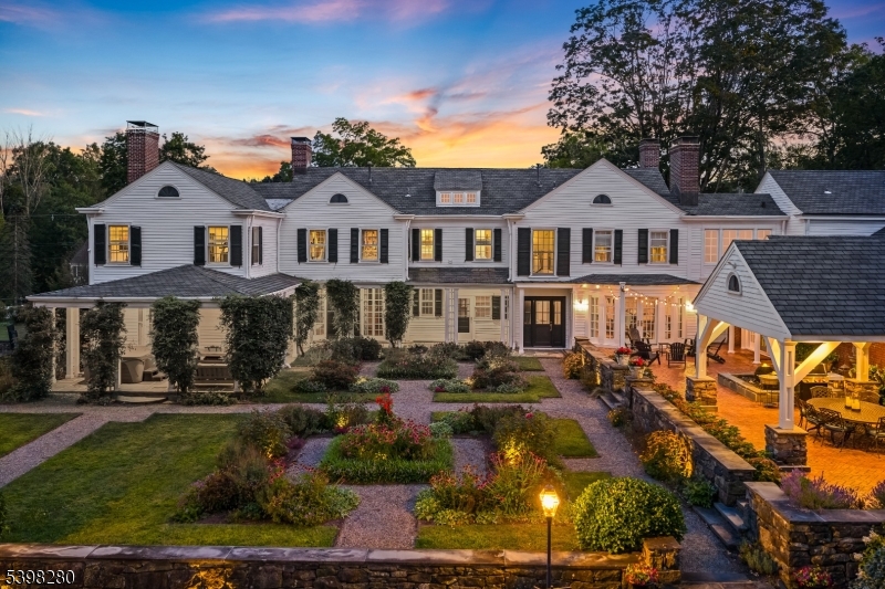 22 Talmage Road Mendham, NJ 07945 - Photo 6 of 46 a front view of a house with a yard
