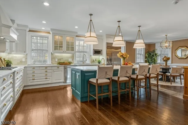 a large kitchen with a table and chairs