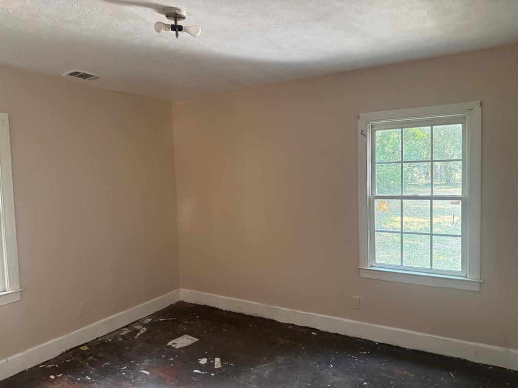 2916 Lee Street Columbus, GA 31903 - Photo 3 of 11 an empty room with a window