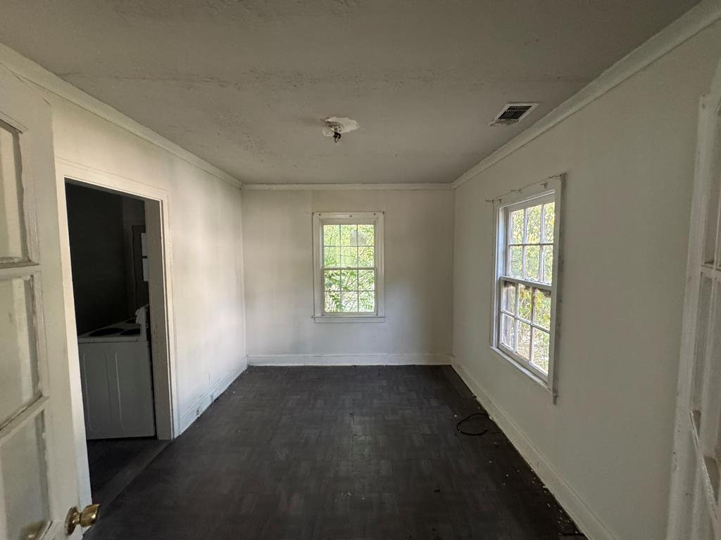 2916 Lee Street Columbus, GA 31903 - Photo 6 of 11 a view of an empty room with a window