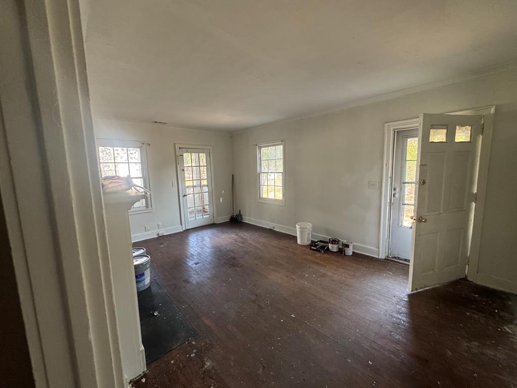 2916 Lee Street Columbus, GA 31903 - Photo 9 of 11 an empty room with windows and entrance