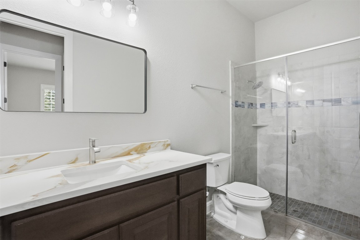 1441 River Vista Road Georgetown, TX 78628 - Photo 11 of 37 Full bath with vanity and a stall shower