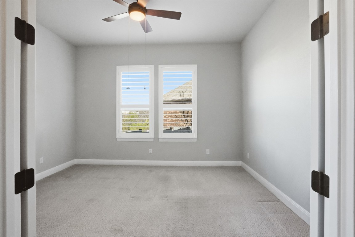 1441 River Vista Road Georgetown, TX 78628 - Photo 13 of 37 Unfurnished room featuring light carpet and ceiling fan
