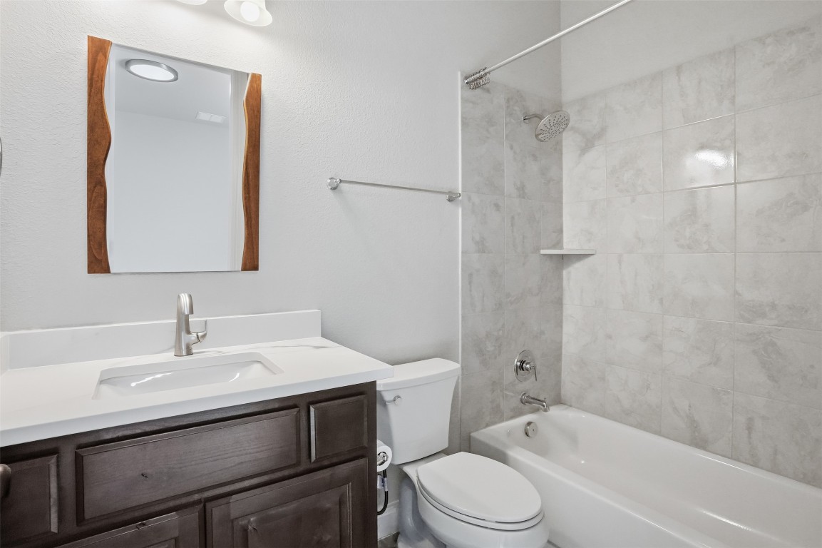 1441 River Vista Road Georgetown, TX 78628 - Photo 16 of 37 Bathroom featuring shower / bathtub combination and vanity