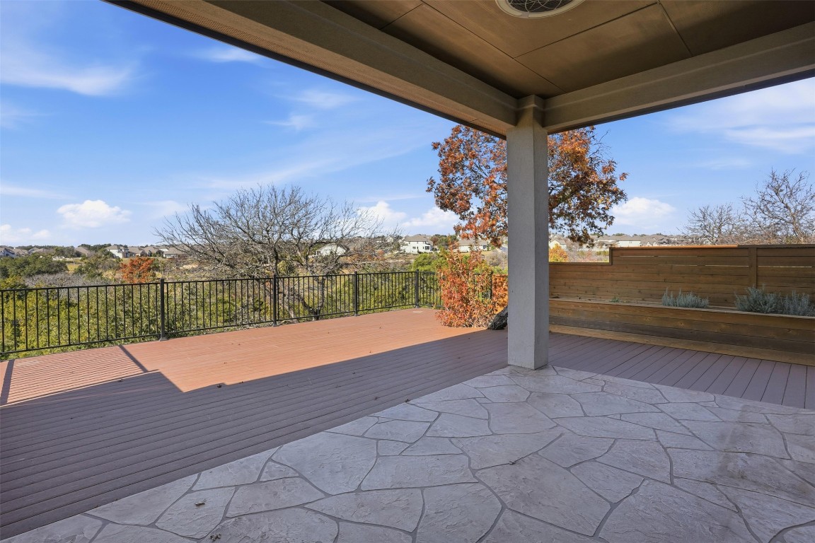 1441 River Vista Road Georgetown, TX 78628 - Photo 32 of 37 Covered patio with a large Trex deck for ease. Amazing views overlooking the GCC golf course and hill country views!