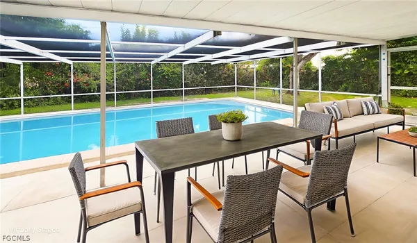 a view of a chairs and table in the patio