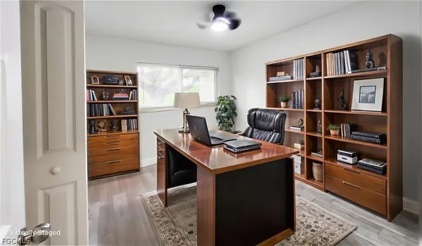 a room with furniture cabinets and window