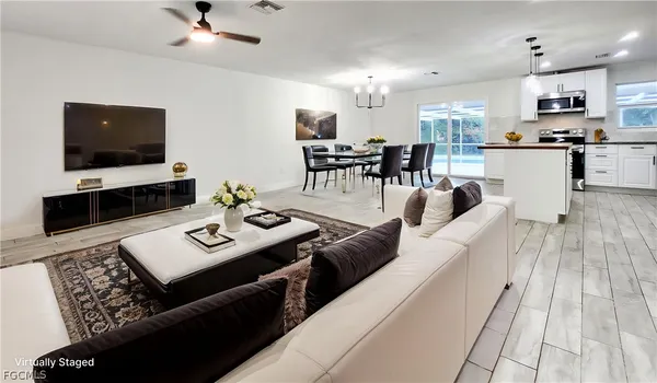 a living room with furniture and a flat screen tv
