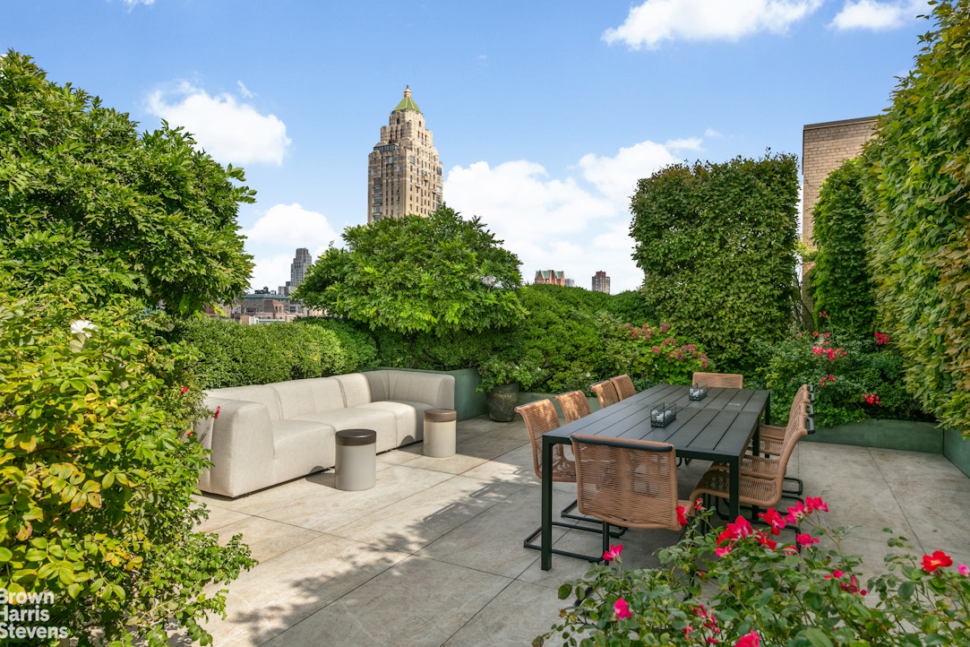 936 5th Avenue, Unit PH Manhattan, NY 10021 - Photo 13 of 21 an aerial view of a chairs and table in the backyard